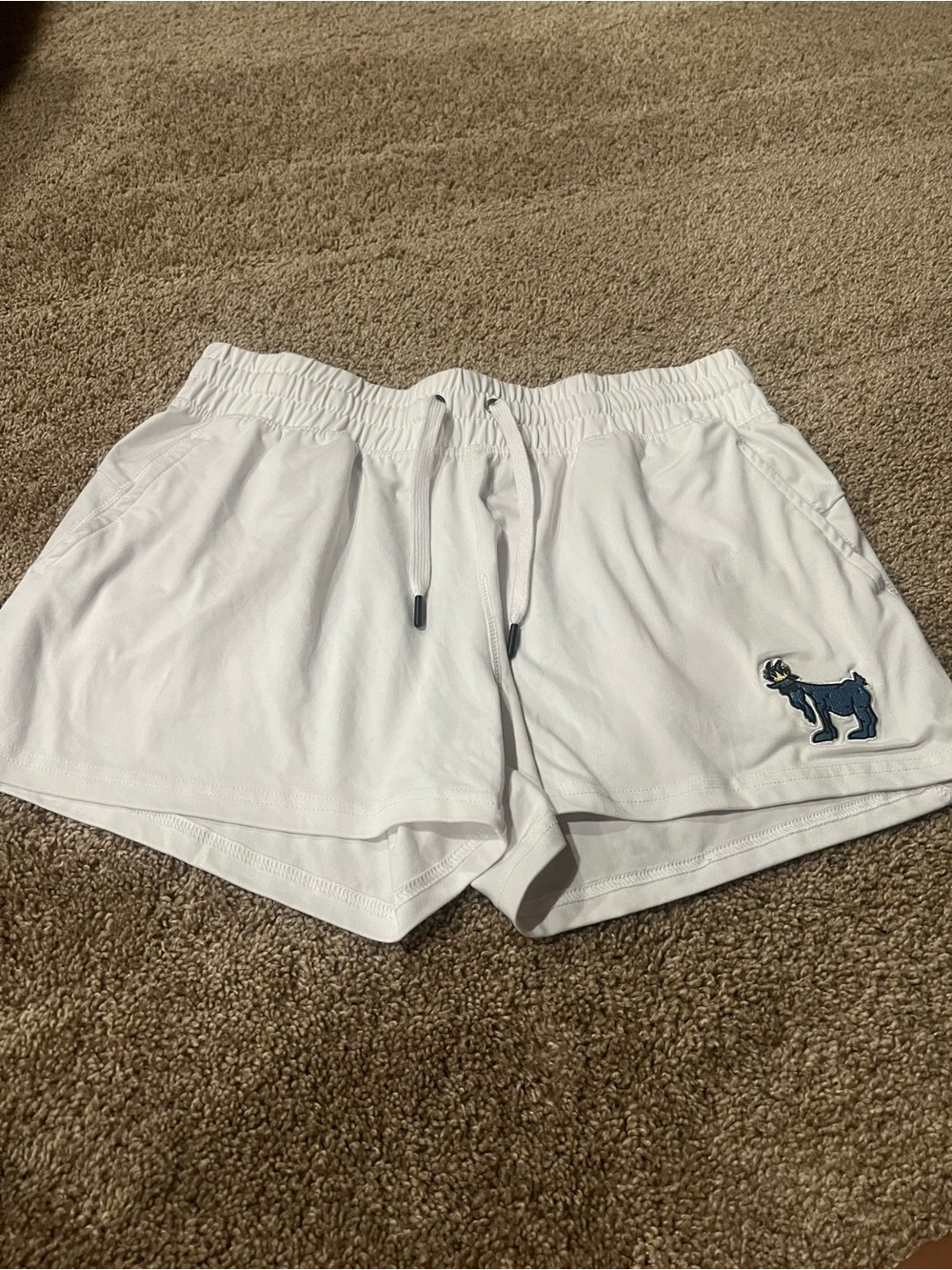 GOAT USA size large white shorts